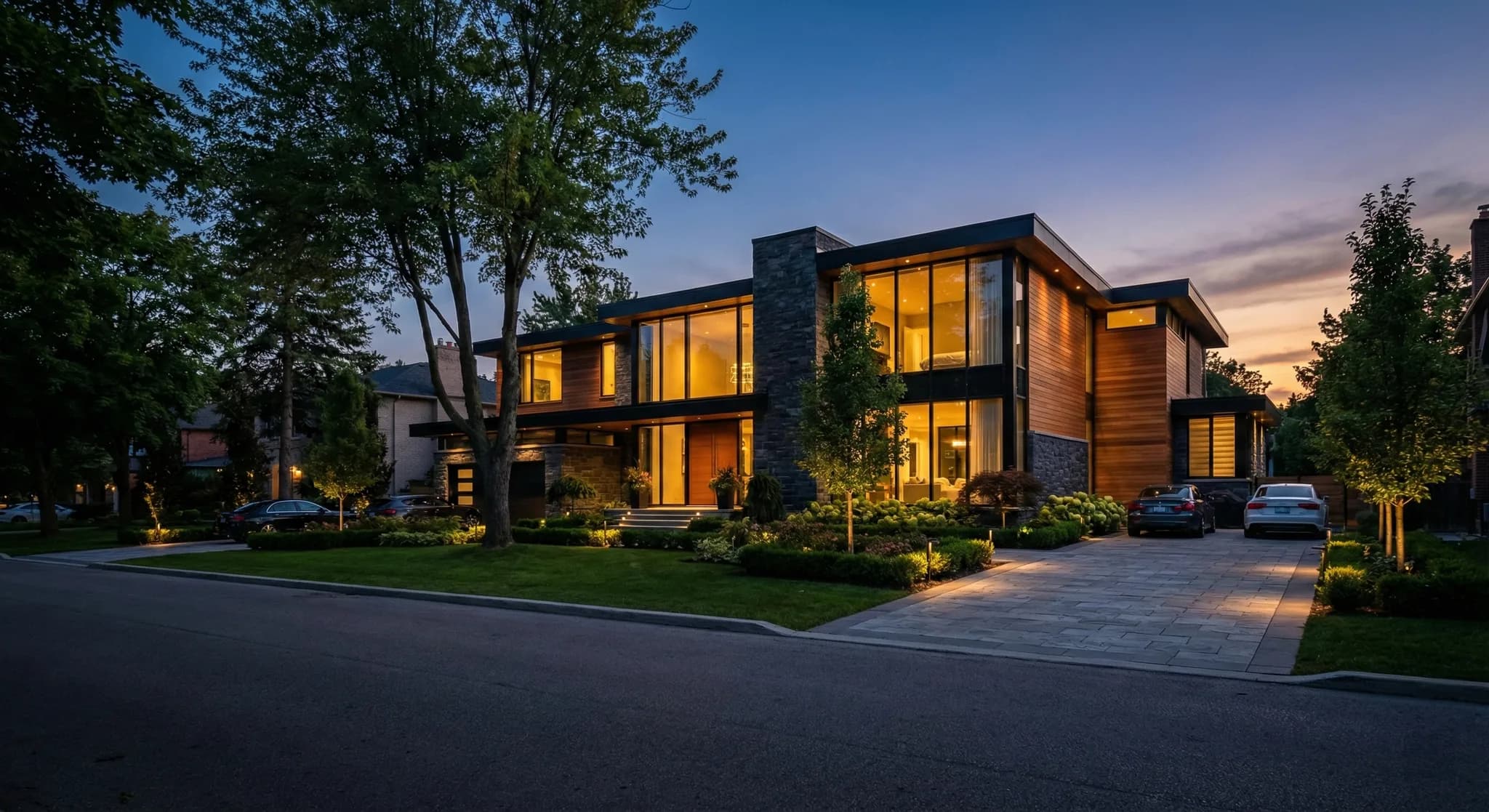 Modern luxury home at dusk before roofline lighting