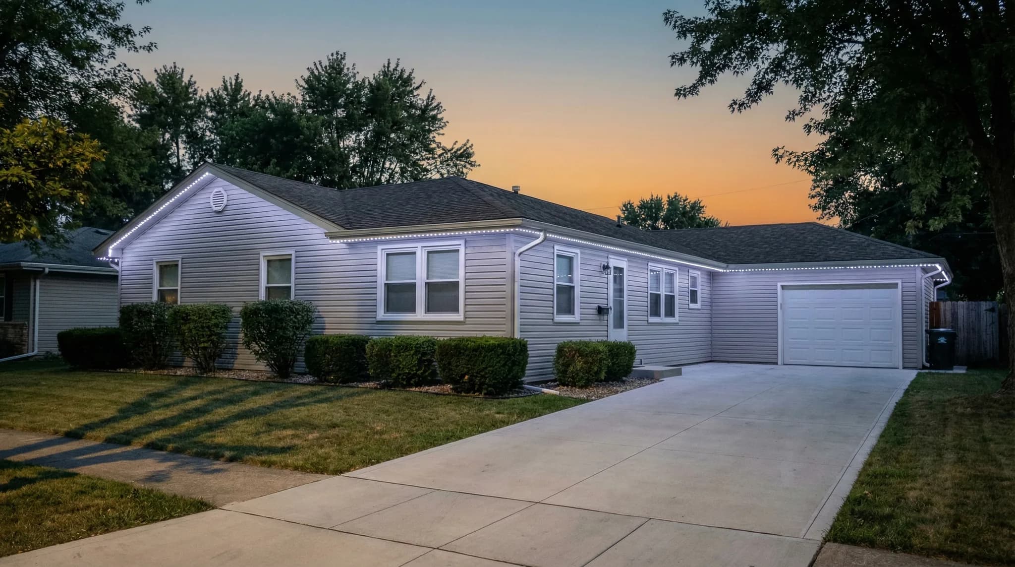 Ranch home with subtle white roofline accent lighting
